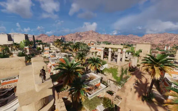 A stunning HD PC desktop wallpaper from Assassin's Creed Origins, showcasing a vibrant ancient city with palm trees and mountainous landscapes under a clear blue sky.