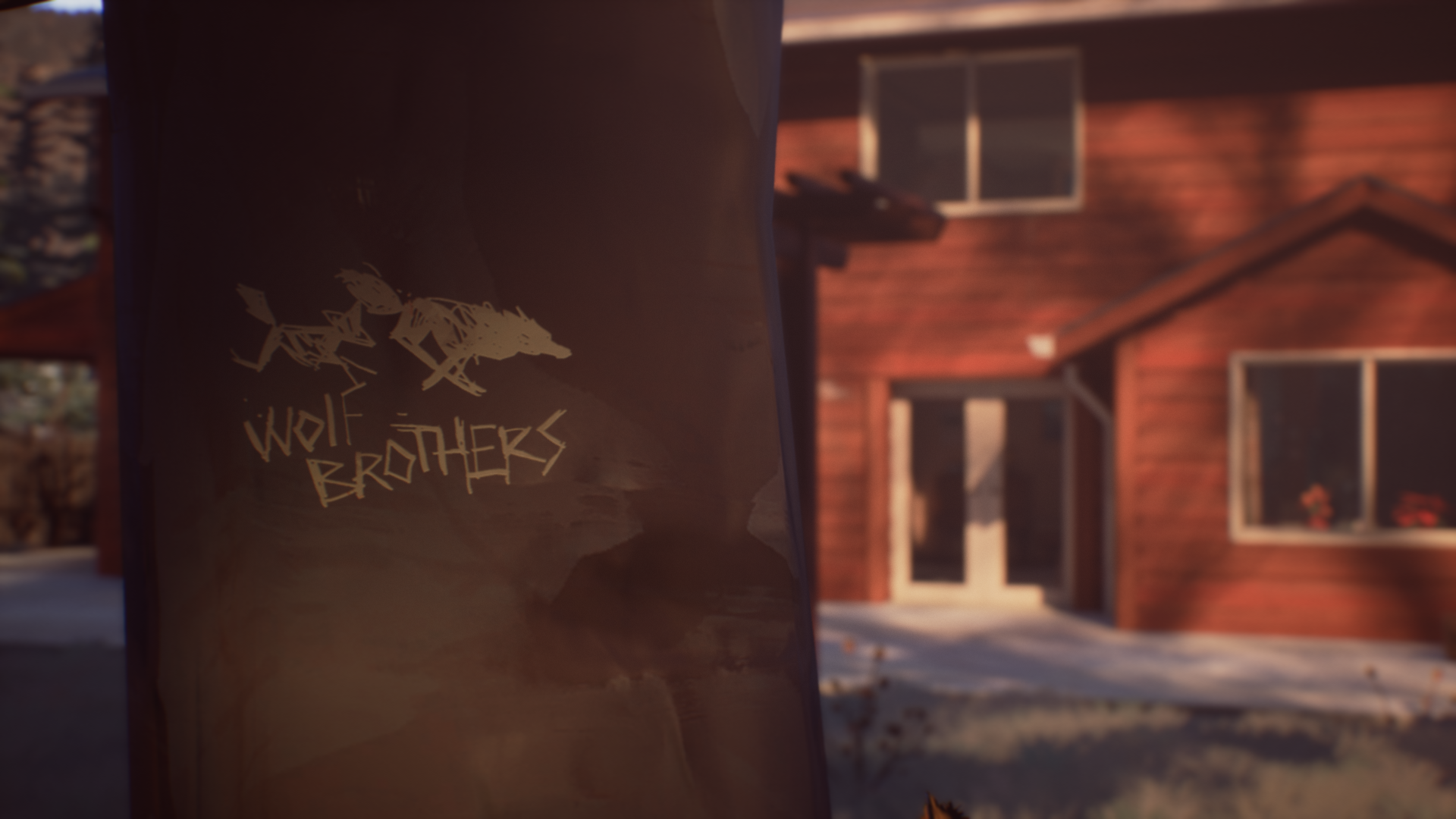 A HD wallpaper featuring a scene from Life Is Strange 2, showcasing the Wolf Brothers graffiti against a backdrop of a cozy, rustic house.