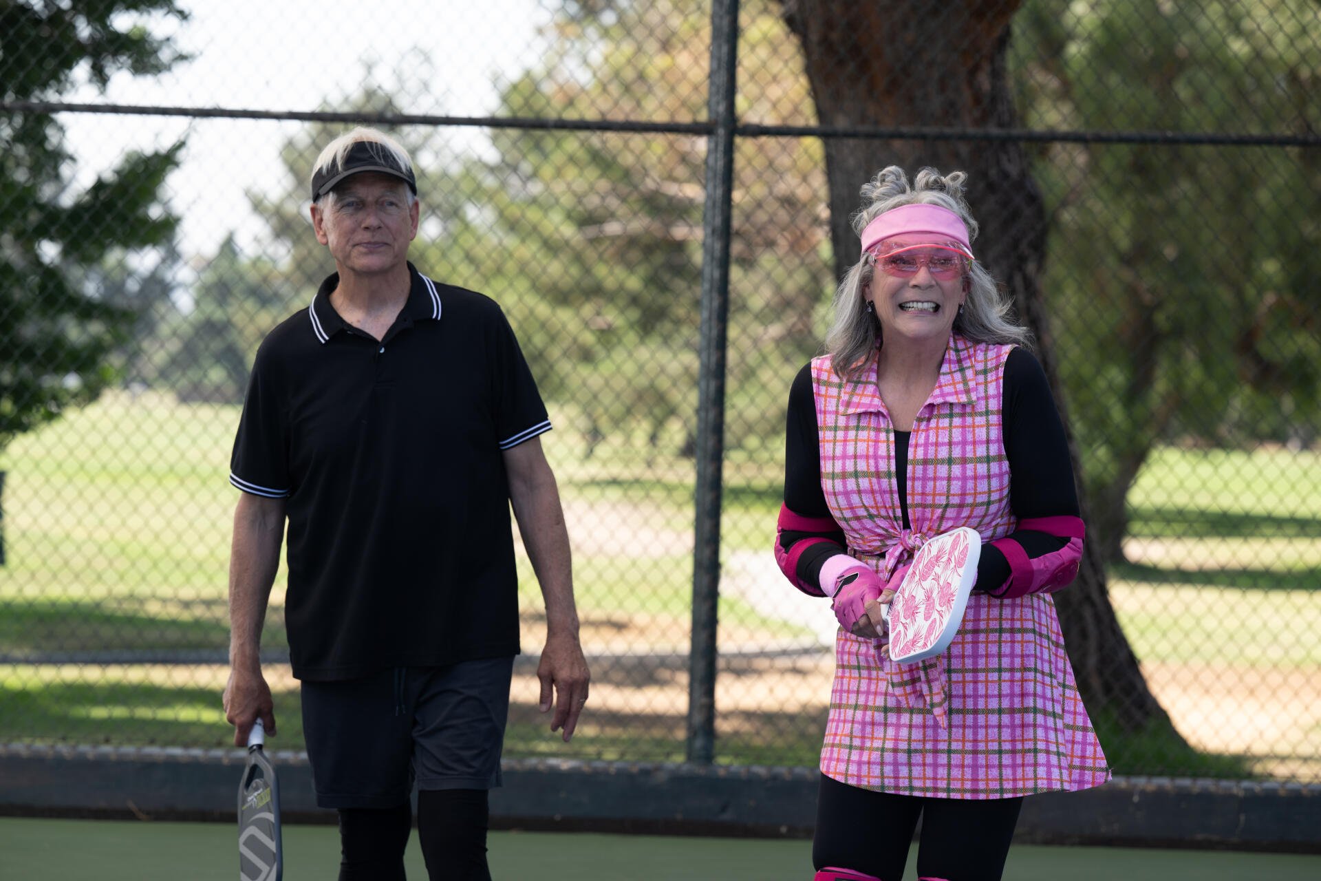 Scene from the movie Freakier Friday featuring Jamie Lee Curtis on a tennis court, captured in vibrant 8K Ultra HD PC desktop wallpaper quality.