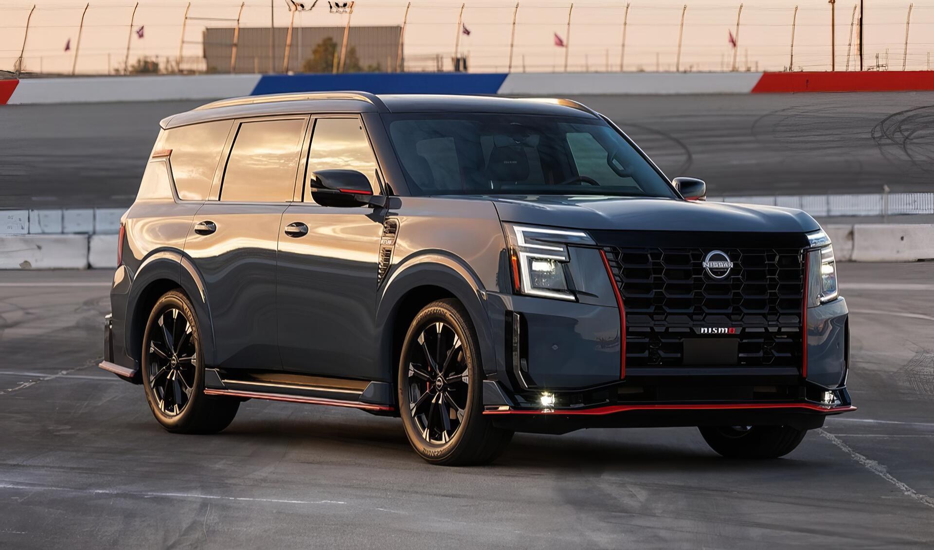 A sleek Nissan Armada NISMO SUV in dark gray with red accents, showcased on a race track, captured in high definition as a PC desktop wallpaper and background.
