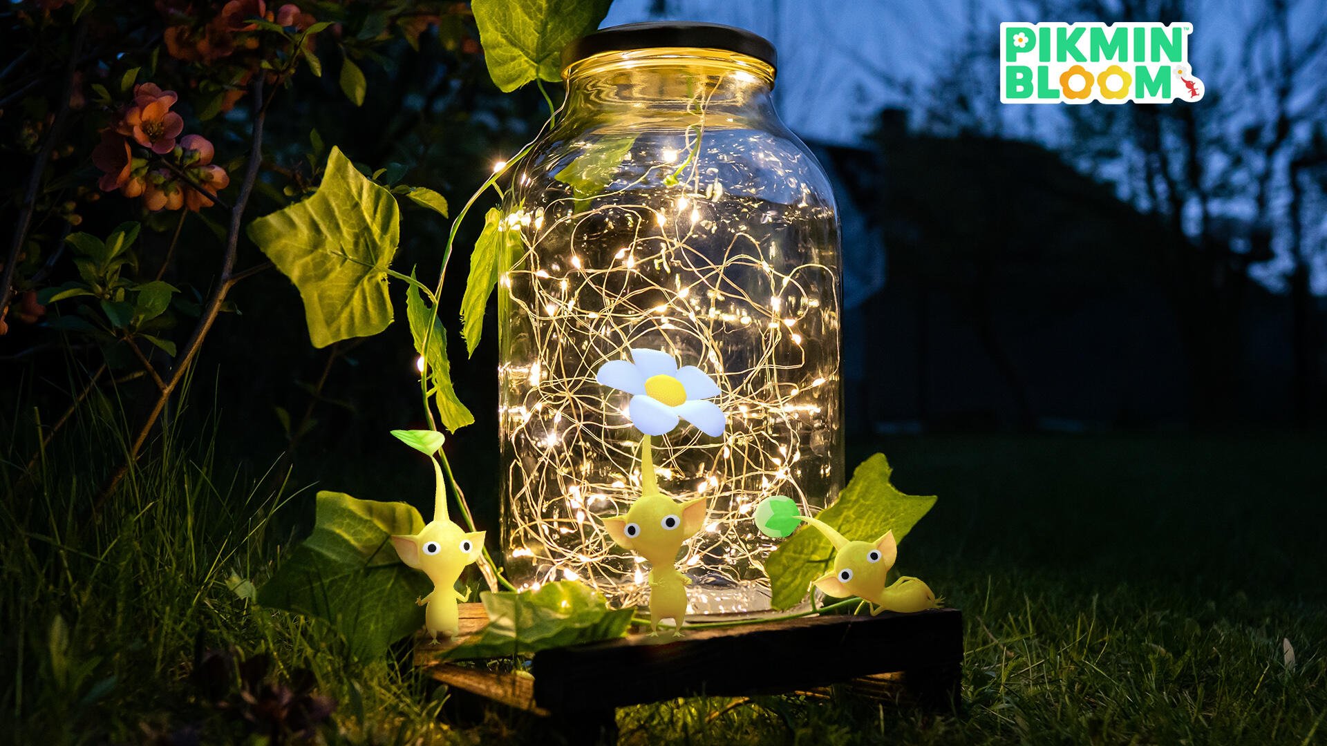 HD Pikmin PC desktop wallpaper featuring glowing Pikmin figures gathered around a jar filled with fairy lights, set outdoors at dusk.