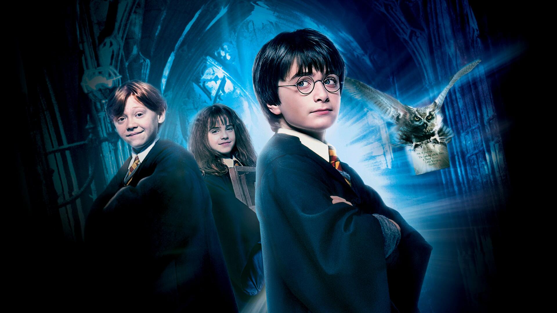 4K Ultra HD PC desktop wallpaper of Harry Potter and the Philosopher's Stone: Harry, Ron and Hermione in Hogwarts cloaks with Hedwig flying through a glowing blue, magical corridor background.