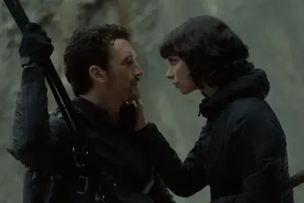 A scene from the movie The Gorge (2025) featuring Miles Teller and Sigourney Weaver, capturing an intense moment between the characters. 8K Ultra HD desktop wallpaper.