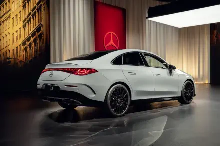 A sleek white Mercedes-Benz CLA parked in a stylish setting, showcasing its modern design and luxury features against an elegant backdrop. 4K Ultra HD desktop wallpaper.