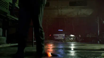 HD PC desktop wallpaper from Resident Evil 7: Biohazard featuring a dimly lit scene with a police car in the background and a figure standing in the foreground.