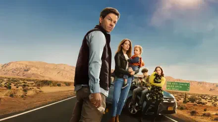 The Family Plan — 4K Ultra HD PC Desktop Wallpaper and Background: family group on a desert highway beside a car and motorcycle, adults and kids under a dramatic sky.