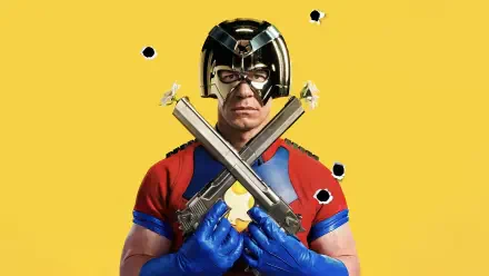 Peacemaker (TV Show) in a chrome helmet and red-and-blue suit, blue gloves crossing two pistols amid bullet holes on a bright yellow 4K Ultra HD PC desktop wallpaper.
