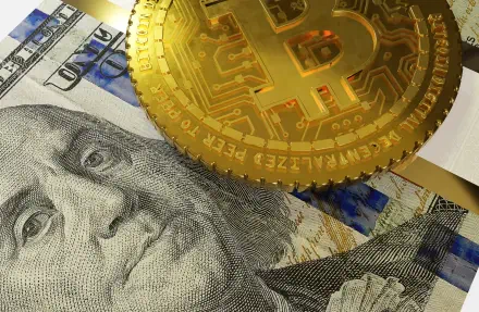 HD PC desktop wallpaper: close-up of a golden bitcoin coin resting on a US dollar banknote, mixing digital currency and paper money imagery for a money/currency background.