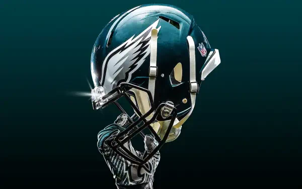 HD wallpaper featuring a detailed Philadelphia Eagles NFL football helmet against a dark background, showcasing the team's iconic wing logo.