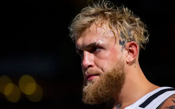 A close-up of YouTuber Jake Paul, showcasing his intense expression, tousled hair, and beard. This striking HD image serves as an engaging desktop wallpaper and background.