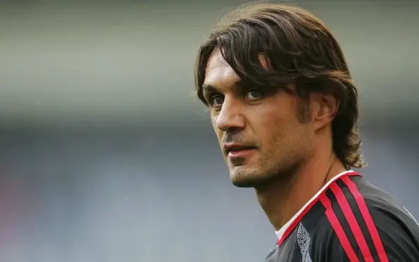 A striking HD wallpaper featuring Paolo Maldini, the legendary A.C. Milan defender, capturing his intense gaze and iconic style in soccer.