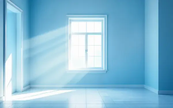 A serene blue-themed room featuring a window that lets in soft, natural light, creating a tranquil atmosphere. This image serves as a 4K Ultra HD PC desktop wallpaper.