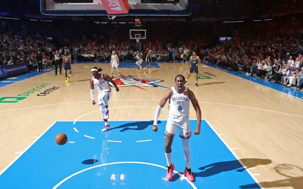 HD NBA Finals action wallpaper featuring Oklahoma City Thunder player Jalen Williams on the court during a basketball game.