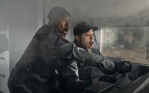 Action-packed scene from the movie The Pickup, featured as a 4K Ultra HD PC desktop wallpaper and background, showing two intense characters in motion.