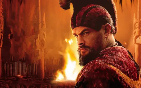 4K Ultra HD PC desktop wallpaper of a stern, bearded Chief of War in red fur-trimmed armor and horned cap, glancing over his shoulder in a torchlit hall with a roaring fire.