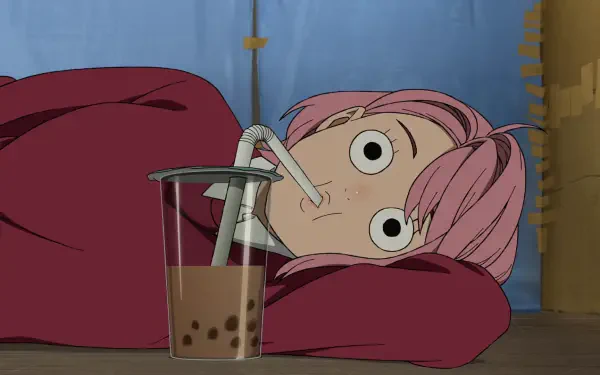 HD PC wallpaper of Aira Shiratori (Dandadan): pink‑haired, wide‑eyed, lying on her side and sipping bubble tea through a straw.