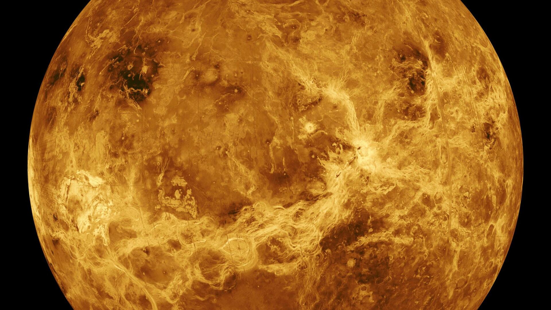 HD PC desktop wallpaper: close-up of a golden planet in space, showing textured rocky surface and swirling cloud-like formations.