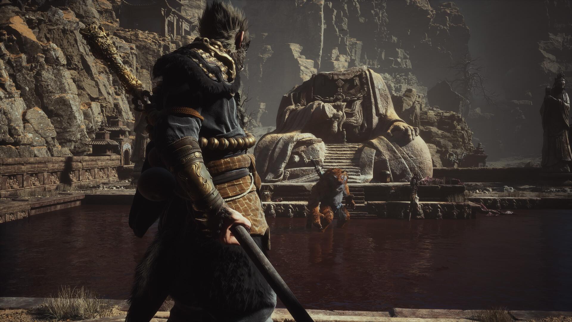 Black Myth: Wukong video game — cloaked warrior with staff faces a massive stone elephant statue in a dim cavernous temple. 4K Ultra HD PC desktop wallpaper/background.