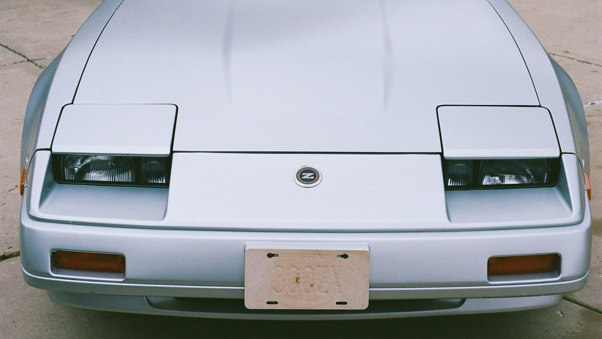 Silver vintage Nissan 300ZX JDM front with pop-up headlights — HD PC desktop wallpaper/background.