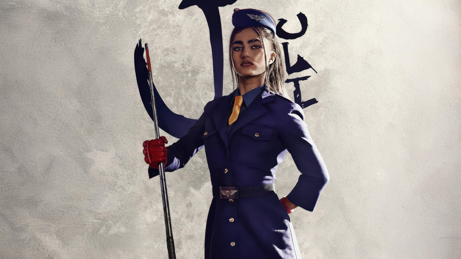 Street Fighter (2026) 5K Ultra HD PC Desktop Wallpaper and Background — confident female fighter in a dark uniform holding a polearm against a textured gray backdrop.
