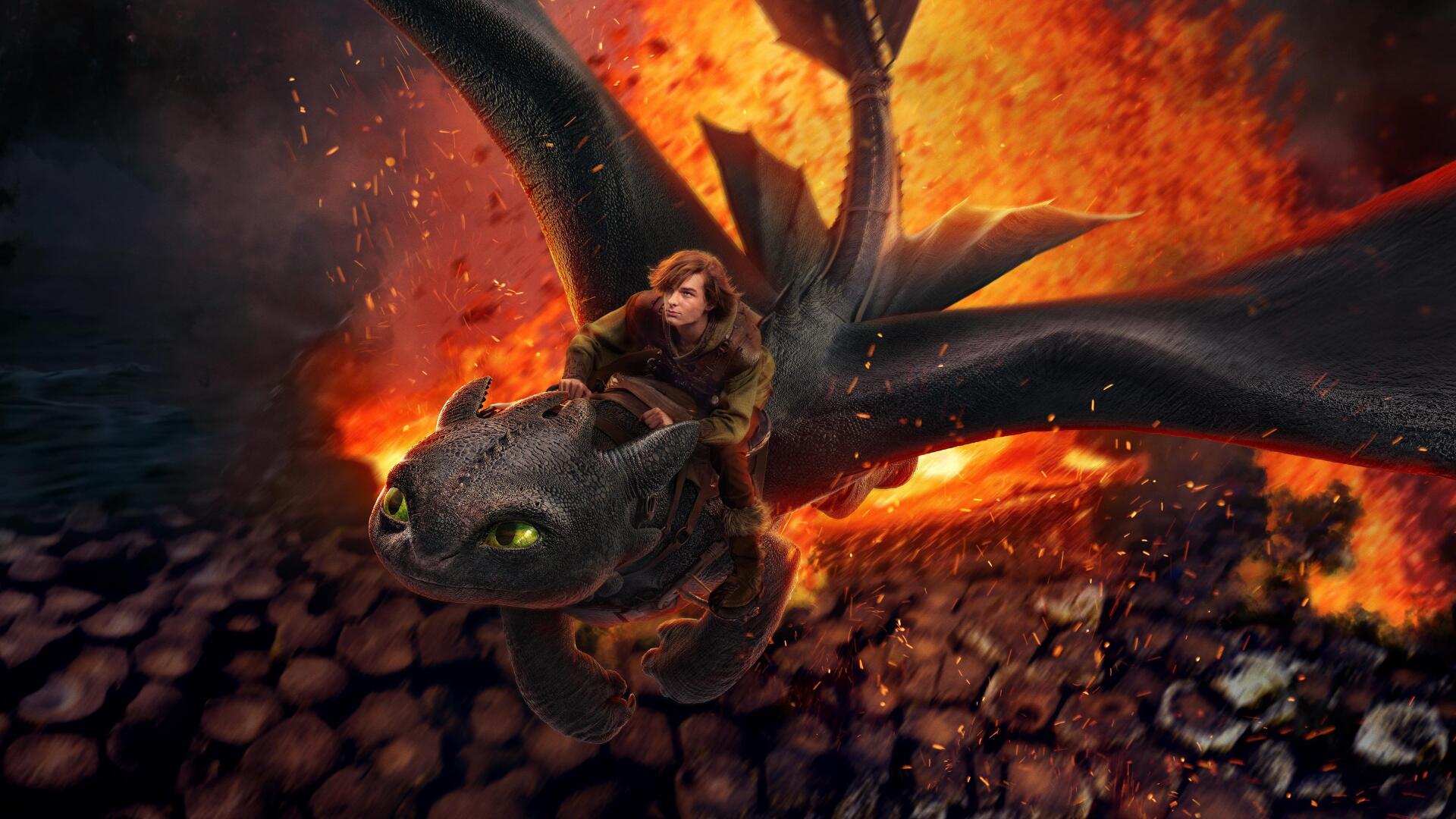 How to Train Your Dragon (2025) 4K Ultra HD PC desktop wallpaper and background: a rider on a black dragon with glowing green eyes swoops over molten, fiery ruins.