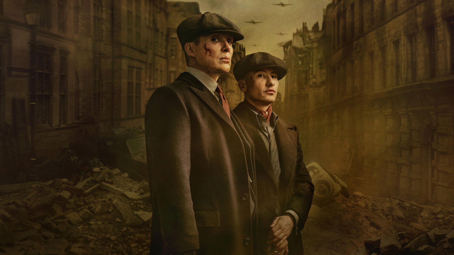 HD PC desktop wallpaper: two stoic flat-capped figures in period coats stand amid a foggy, war-torn street, Peaky Blinders: The Immortal Man.
