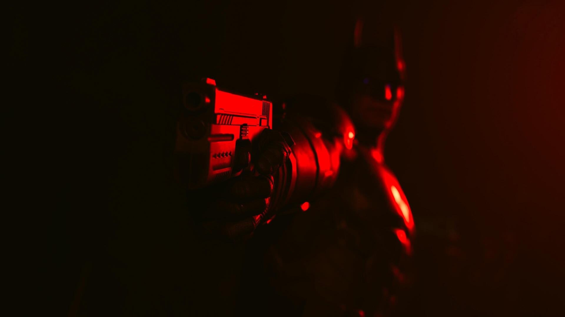 4K Ultra HD PC wallpaper: Suicide Squad: Kill the Justice League game art — dark, red-lit close-up silhouette of Batman holding a weapon against a shadowed, moody background.
