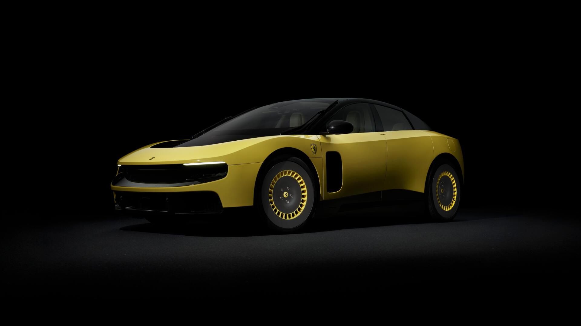 Sleek yellow Ferrari Luce vehicle in dramatic low light against a black background — 4K Ultra HD PC desktop wallpaper and background.