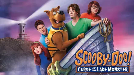 HD PC desktop wallpaper for Scooby-Doo! Curse of the Lake Monster: Scooby-Doo and the Mystery Inc. gang crowd a boat near a foggy lakeshore and lighthouse.