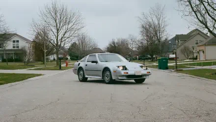 Silver Nissan 300ZX retro vintage car on a quiet suburban street, HD PC desktop wallpaper background.