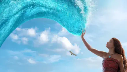 Moana (Live Action) reaches to touch a cresting turquoise wave against a bright sky — 4K Ultra HD PC desktop wallpaper background.