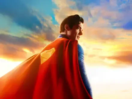 Superman (2025) TV show — Superman in blue suit and flowing red cape gazes toward a golden sunrise; 4K Ultra HD PC desktop wallpaper and background.