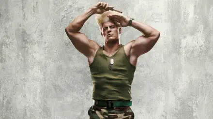 Street Fighter (2026) 2K Quad HD PC wallpaper/background — muscular blond soldier in a green tank top, dog tags and camo pants posing against a textured concrete backdrop.
