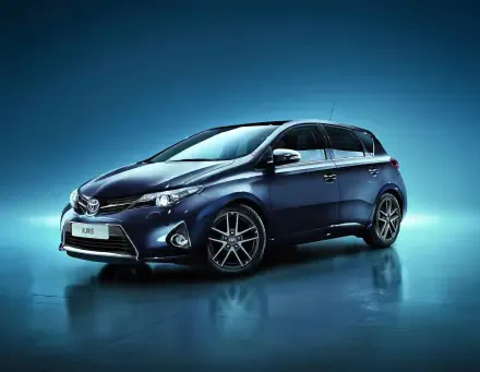 Blue Toyota Auris car, a hatchback, on a reflective surface with a blue gradient backdrop — HD PC desktop wallpaper/background.