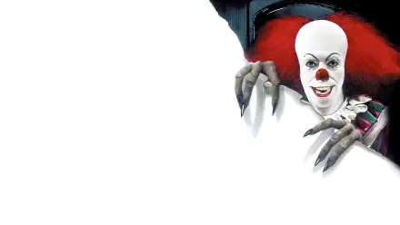 Pennywise from It (1990) peers with red hair and clawed fingers over white space — 4K Ultra HD PC desktop wallpaper and background.