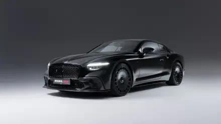 5K Ultra HD PC desktop wallpaper of a black Brabus 900 supercar in a studio setting, glossy finish and aggressive stance with Brabus badging.