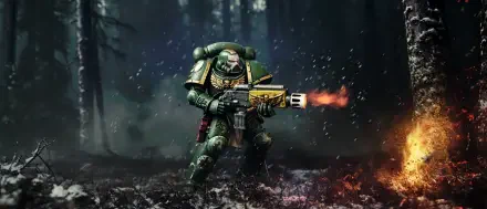 5K Ultra HD PC desktop wallpaper: Warhammer 40k video game Salamanders Space Marine in green power armor firing a flamer amid a smoky, ember-lit forest.