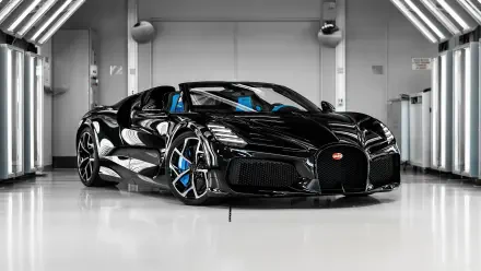 Black Bugatti W16 Mistral hypercar in a glossy showroom, 5K Ultra HD PC desktop wallpaper/background.