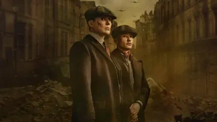 HD PC desktop wallpaper: two stoic flat-capped figures in period coats stand amid a foggy, war-torn street, Peaky Blinders: The Immortal Man.