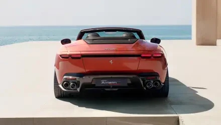 Rear view of a red Ferrari Amalfi Spider convertible by the sea; 4K Ultra HD PC desktop wallpaper and background.