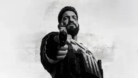 The Punisher: One Last Kill — grayscale 4K Ultra HD PC desktop wallpaper of the Punisher pointing a pistol at the viewer against a textured background.