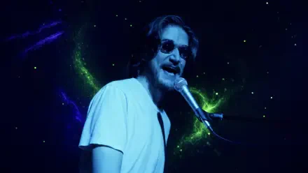 Performer singing into a microphone with neon galaxy swirls behind them — 4K Ultra HD PC desktop wallpaper and background.