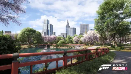 Forza Horizon 6 video game 4K Ultra HD PC desktop wallpaper: scenic park with red wooden bridge over a pond, cherry blossoms and trees, modern city skyline under a blue sky.