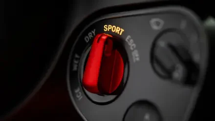 4K Ultra HD PC desktop wallpaper: close-up of a Ferrari Luce vehicle interior, focusing on a red SPORT drive-mode selector knob.