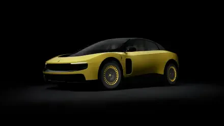 Sleek yellow Ferrari Luce vehicle in dramatic low light against a black background — 4K Ultra HD PC desktop wallpaper and background.