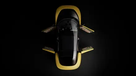 Top-down view of a Ferrari Luce sports car with yellow accents and gullwing doors open on a black background — 4K Ultra HD PC desktop wallpaper.