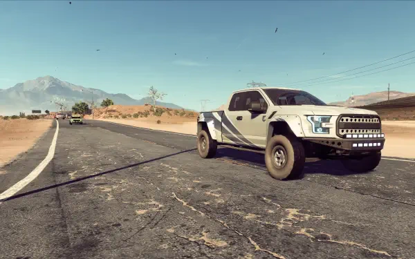 HD PC desktop wallpaper showing a Ford Raptor tearing down a sunlit desert highway in Need for Speed Heat, VW GTI visible in the distance.