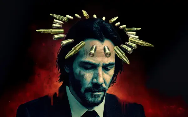 5K Ultra HD PC desktop wallpaper of John Wick in a dark suit, a halo of bullets above his head against a red-black moody backdrop.