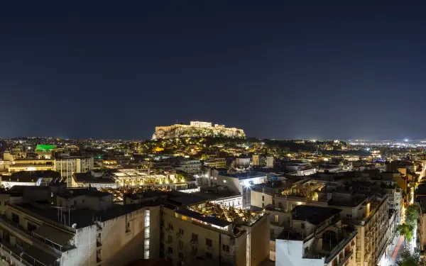 Night panorama of Athens, Greece with the illuminated Acropolis over sprawling city lights — 5K Ultra HD PC desktop wallpaper and background.