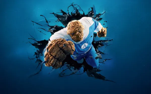 The Fantastic Four: First Steps — The Thing bursting through a cracked blue wall, reaching toward the viewer; 4K Ultra HD PC desktop wallpaper/background.